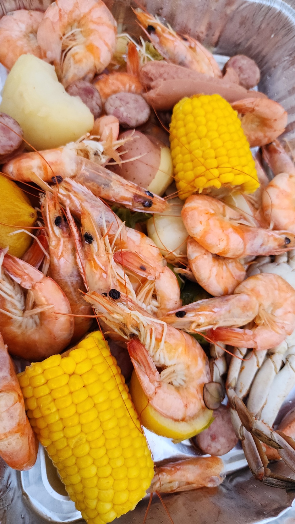 Low-country seafood boil with shrimp, crab, corn, sausage, and potatoes
