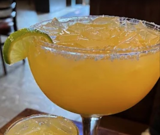 Vallarta Mexican Restaurant mango margarita with salted rim and lime
